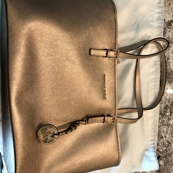 Michael Kors Handbags - Gold Michael Kors Jet Set Tote. NWT.